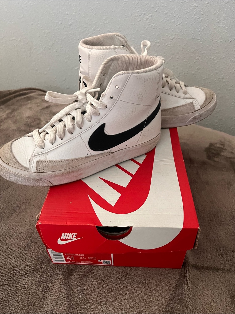Nike White High-Top Sneakers with Black Swoosh